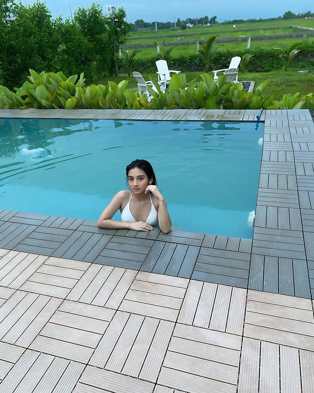 Freshwater infinity pool at Kalinaya — green landscape